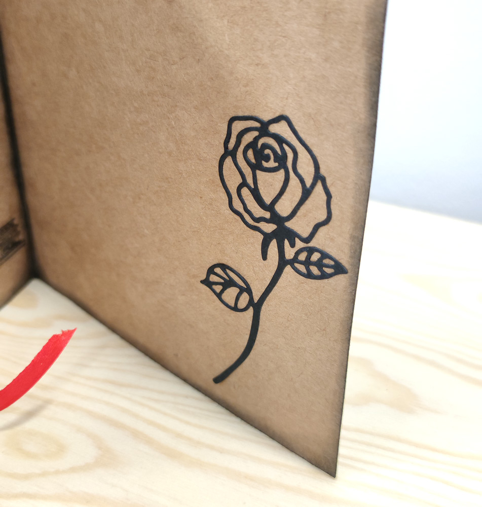 Tarjeta día de la rosa y el libro